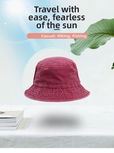 Detail view of burgundy washed cotton bucket hat with vintage texture and reinforced stitching