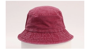 Close-up of the washed cotton fabric and multi-row stitching on the red bucket hat brim
