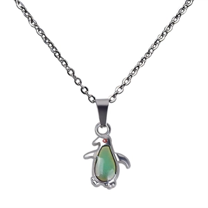 Detail of penguin pendant with temperature color changing stone and red rhinestone eye