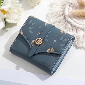 Three-fold leather leaf print wallet with golden leaf clasp in elegant grey-blue color