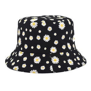 Detail of cotton daisy print bucket hat showing fabric texture and embroidery on black canvas