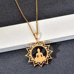 Golden stainless steel necklace featuring a lotus flower and sitting Buddha silhouette pendant