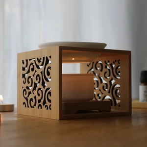 Bamboo oil burner with hollow cloud pattern and ceramic bowls for aromatherapy