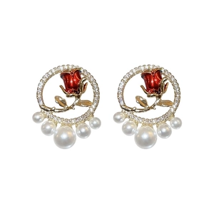 Golden tulip pearl earrings with red rose and crystal pavé circle on white background