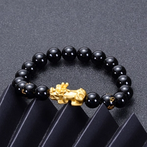 Natural black agate bracelet with golden Pi Xiu and engraved mantra beads in a sleek design