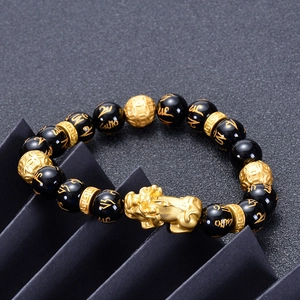 Feng Shui black obsidian wealth bracelet with golden Pi Xiu and engraved mantra beads