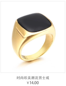 Detail of a men's gold signet ring featuring a polished flat black stone inlay surface