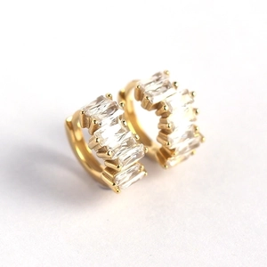 Elegant gold S925 silver hoop earrings with rectangular baguette cut zircons on white backdrop