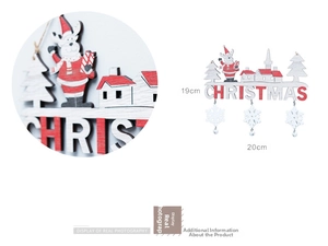 Detail of wooden Christmas door hanger with Santa Claus painting and snowflake bells