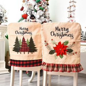 Christmas burlap chair covers with reindeer and tree patterns and festive ruffles