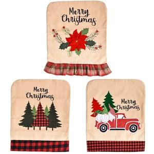 Three Christmas linen chair covers with festive truck, flower and tree patterns