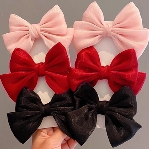 Set of six satin bow hair clips in pink red and black with elegant fringe detail