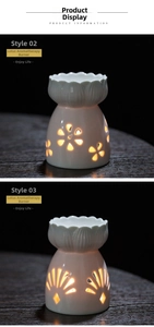 Close-up of white ceramic essential oil burners with lotus-shaped hollow petal designs