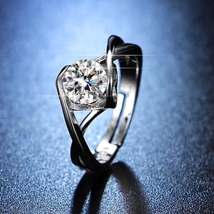 Macro view of a brilliant one-carat moissanite ring with elegant six-prong silver setting