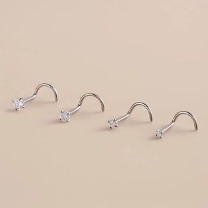 Set of four G23 titanium nose studs with clear cubic zirconia in varying sizes