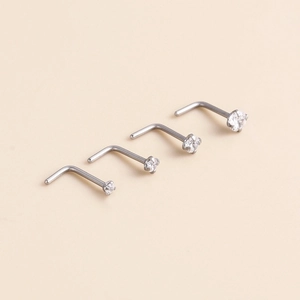 Set of 4 G23 titanium L-shaped nose studs with clear zircon stones in varying sizes