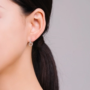 S925 sterling silver hoop earrings with sparkling round drop pendants on model