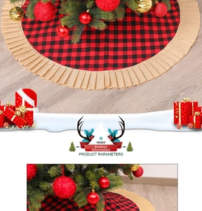 Close-up of red and black plaid Christmas tree skirt with beige ruffled burlap trim