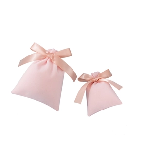 Soft pink velvet drawstring jewelry pouches with satin ribbon bows in two various sizes