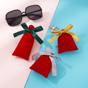 Red velvet drawstring jewelry pouches with green, gold and grey satin ribbon closures
