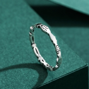 Minimalist S925 sterling silver fish ring with vintage finish on dark background