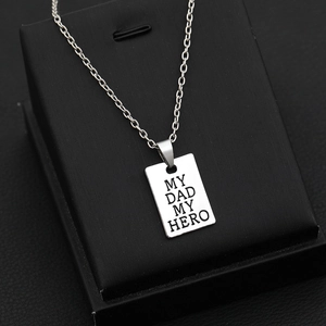 Detailed close-up of My Dad My Hero engraved silver pendant in a black gift box