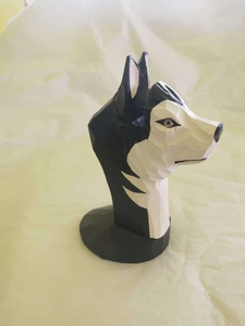 Hand-carved wooden husky glasses holder with geometric painted details on fabric