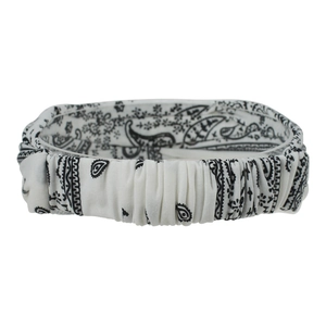 Close-up of white paisley print elastic headband with bohemian pleated texture