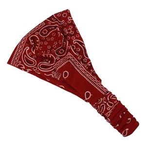 Detailed view of red bandana print headband featuring classic paisley patterns and elastic band