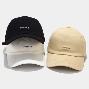 Three embroidered baseball caps in black, off-white, and khaki with CRUISE lettering