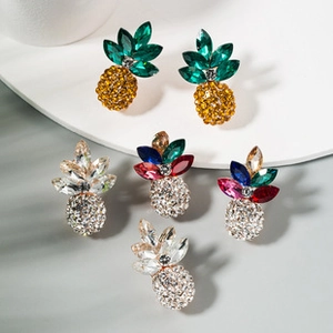Detailed view of pineapple-shaped rhinestone earrings in gold, silver, and multicolored crystal