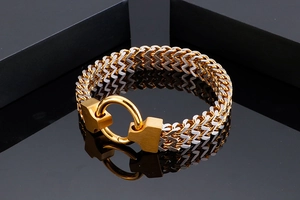Detail of two-tone stainless steel curb chain bracelet with heavy duty ring clasp
