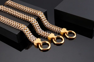 Detail of two-tone gold and silver stainless steel keel chains with round clasp buckles