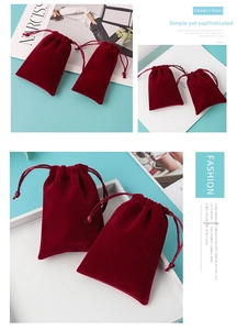 Detailed views of burgundy velvet jewelry pouches with a functional drawstring closure