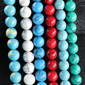 Strands of round natural turquoise and agate beads showing diverse colors and textures