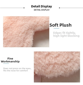 Close-up of pink faux rabbit fur sleep mask with ergonomic nose wing for light blocking