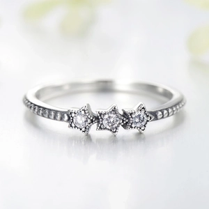 Minimalist sterling silver star ring with beaded texture and sparkling clear gems