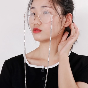 Silver stainless steel eyeglass chain with cylindrical links on a model's side profile