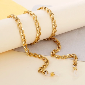 Detailed view of thick gold stainless steel eyewear chain with silicone loops and lobster clasp