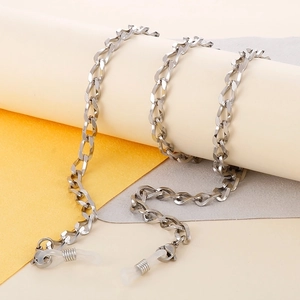 Detailed view of silver cuban link eyewear chain with clear silicone connectors
