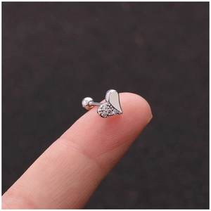 Creative stainless steel heart stud earring with zircon held on a fingertip