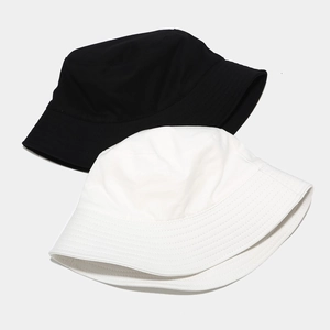 Minimalist double-sided cotton bucket hats in black and ivory white for men and women