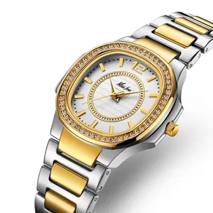 Elegant gold and silver two-tone ladies watch with crystal bezel and oval dial