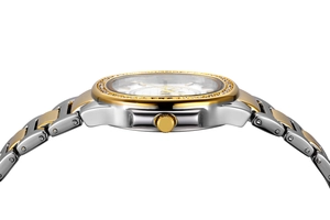 Close-up of diamond-encrusted gold and silver watch bezel and link bracelet profile