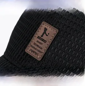 Detail of breathable mesh baseball cap with embossed leather patch and golf logo