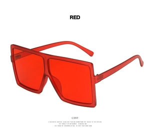 Detailed side view of bold red square oversized sunglasses with thick PC frame