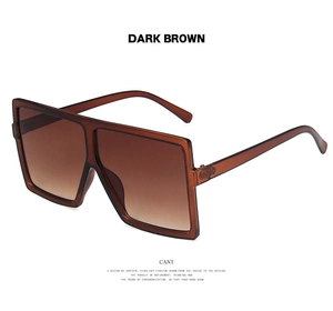 Detailed side view of dark brown oversized square sunglasses with sleek metal temples