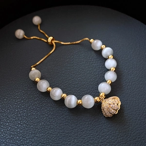 Elegante bracciale con pietra occhio di gatto e conchiglia con placcatura in oro, regolabile