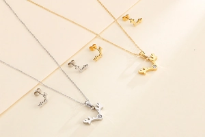 Detail of gold and silver reindeer antler jewelry sets with shimmering embedded crystals