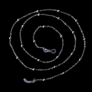 Silver beaded metal eyewear chain with adjustable silicone loops on black background